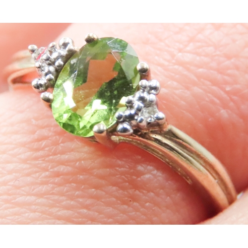 271 - Peridot Set Ring Mounted in 9 Carat Yellow Gold Diamond Inset to Shoulders Ring Size O and a Half