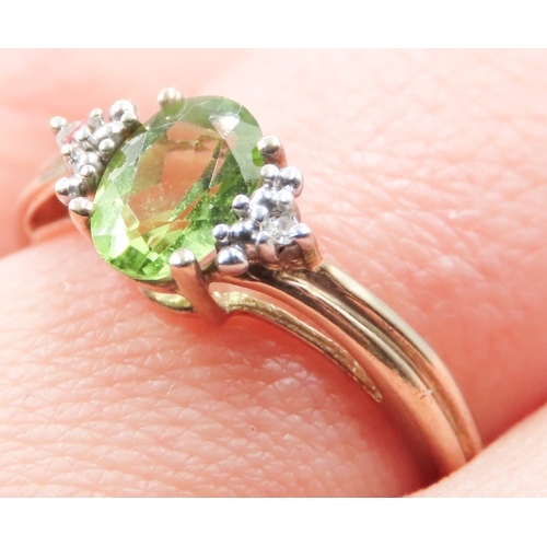 271 - Peridot Set Ring Mounted in 9 Carat Yellow Gold Diamond Inset to Shoulders Ring Size O and a Half