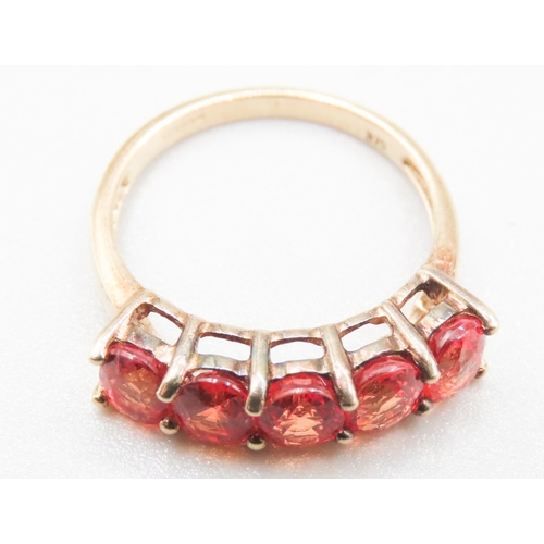 314 - Orange Garnet Five Stone Set Ring Mounted in 9 Carat Yellow Gold Ring Size L and a Half