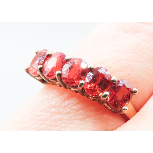 314 - Orange Garnet Five Stone Set Ring Mounted in 9 Carat Yellow Gold Ring Size L and a Half