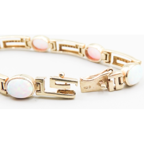 326 - Opal Seven Stone Set Geometric Form Link Bracelet Mounted in 9 Carat Yellow Gold 20cm Long