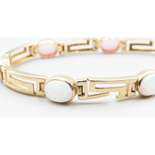 326 - Opal Seven Stone Set Geometric Form Link Bracelet Mounted in 9 Carat Yellow Gold 20cm Long