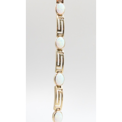 326 - Opal Seven Stone Set Geometric Form Link Bracelet Mounted in 9 Carat Yellow Gold 20cm Long