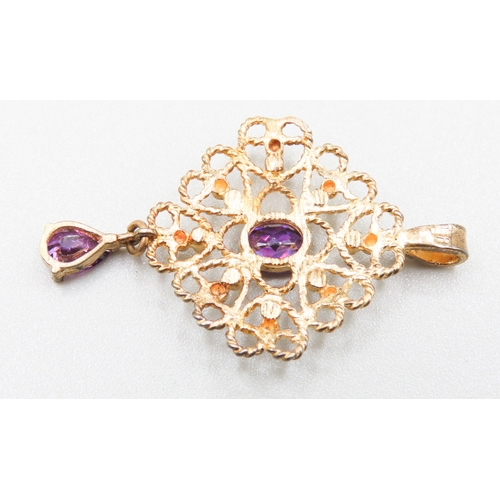 330 - Oval and Pear Cut Amethyst Set Filigree Form Pendant Attractively Detailed Mounted in 9 Carat Yellow... 