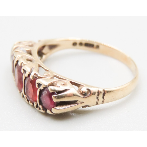 344 - Red Garnet Five Stone Set Ring Mounted in 9 Carat Yellow Gold Ring Size M