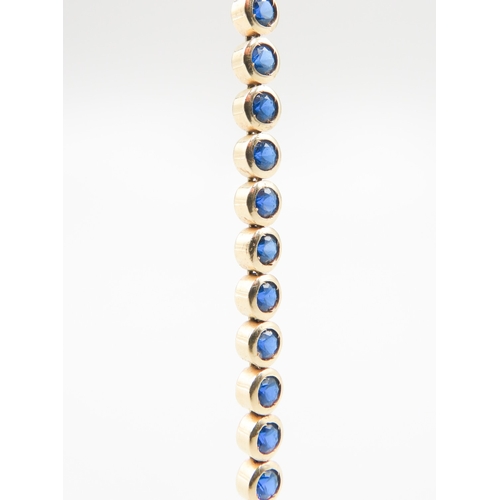 356 - Forty Stone Sapphire Bezel Set Bracelet Mounted in 14 Carat Yellow Gold 19cm Long Clasp Needs Repair