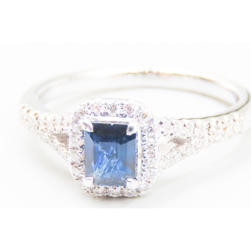 47 - Sapphire Centre Stone Ring with Diamond Set Halo Surround Mounted in 18 Carat White Gold Further Dia... 