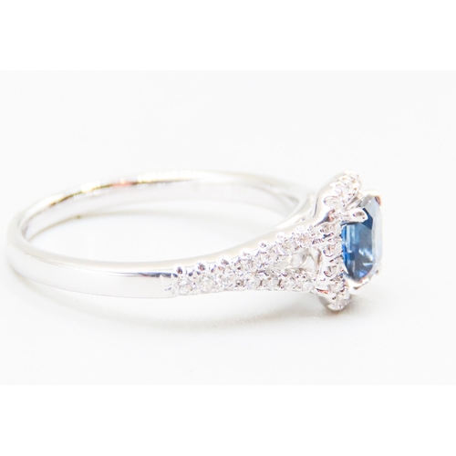 47 - Sapphire Centre Stone Ring with Diamond Set Halo Surround Mounted in 18 Carat White Gold Further Dia... 