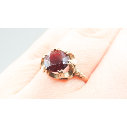 490 - Red Garnet Set Single Stone Ring Mounted in 9 Carat Yellow Gold Ring Size P and a Half