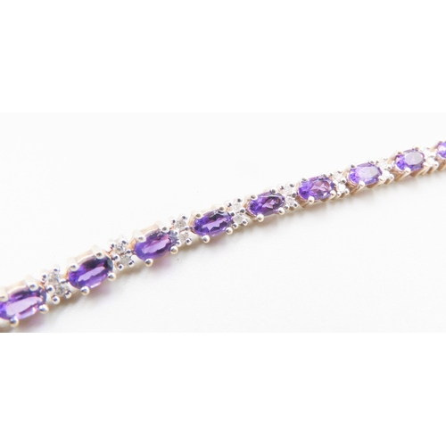 502 - Amethyst Twenty Six Stone Set Bracelet with Further Diamond Insets Mounted in 9 Carat Yellow Gold 19... 