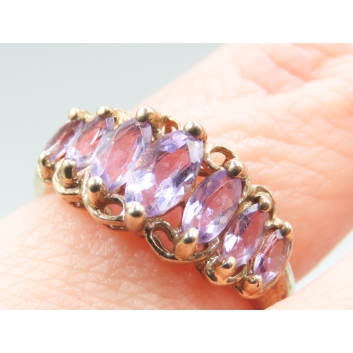 535 - Marquise Cut Amethyst Seven Stone Graduated Form Ring Mounted in 9 Carat Yellow Gold Ring Size M