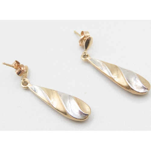 570 - Pair of 9 Carat Yellow and White Gold Twist Form Drop Earrings Each 3cm Drop