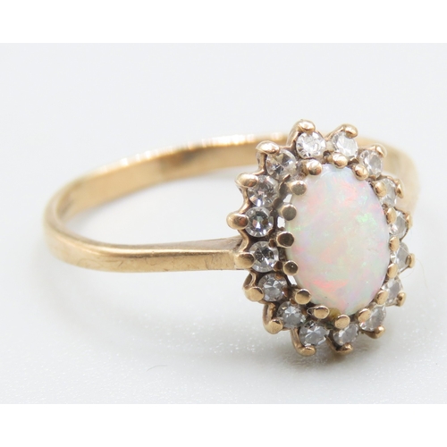 678 - Opal and Gemstone Set Ring Mounted in 9 Carat Yellow Gold Ring Size M