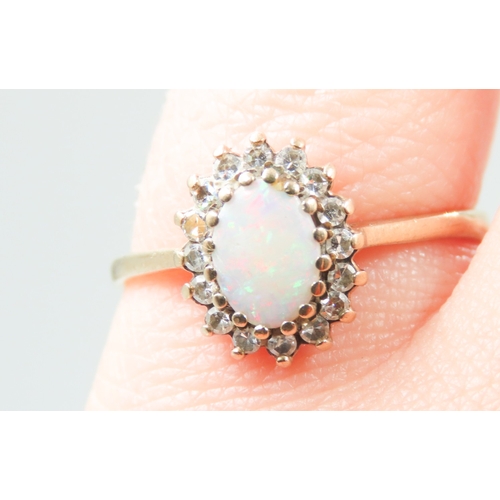 678 - Opal and Gemstone Set Ring Mounted in 9 Carat Yellow Gold Ring Size M