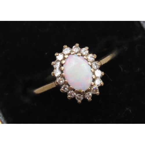 678 - Opal and Gemstone Set Ring Mounted in 9 Carat Yellow Gold Ring Size M