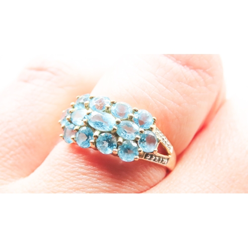 68 - Blue Topaz Set Ladies Cluster Ring Mounted in 9 Carat Yellow Gold Ring Size P and a Half