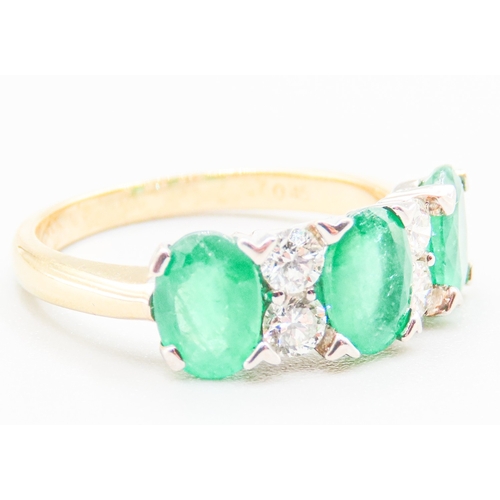 69 - Columbian Emerald Three Stone and Diamond Set Ladies Ring Mounted in 18 Carat Yellow Gold Total Emer... 