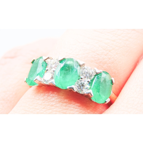 69 - Columbian Emerald Three Stone and Diamond Set Ladies Ring Mounted in 18 Carat Yellow Gold Total Emer... 