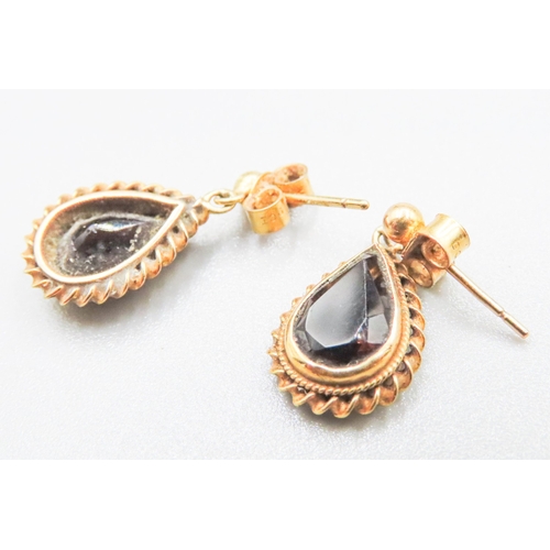 83 - Pair of Pear Cut Smoky Quartz Drop Earrings Mounted in 9 Carat Yellow Gold 2cm High