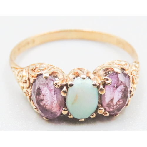 85 - Amethyst and Opal Set Ladies Three Stone Ring Mounted in 9 Carat Yellow Gold Ring Size O and a Half