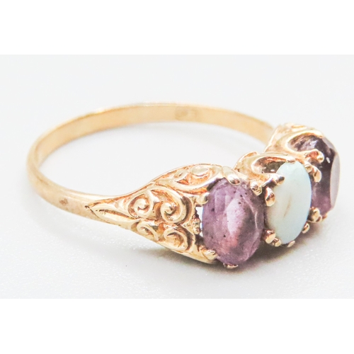 85 - Amethyst and Opal Set Ladies Three Stone Ring Mounted in 9 Carat Yellow Gold Ring Size O and a Half