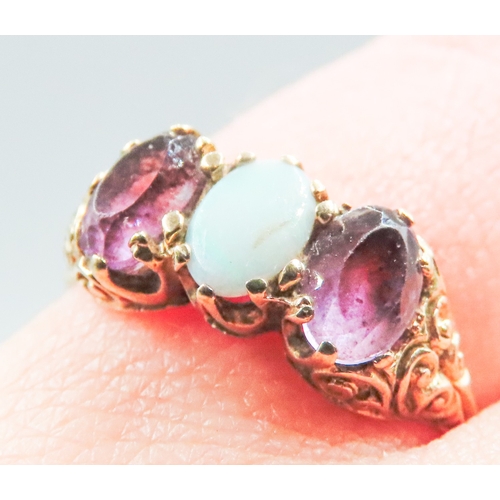 85 - Amethyst and Opal Set Ladies Three Stone Ring Mounted in 9 Carat Yellow Gold Ring Size O and a Half