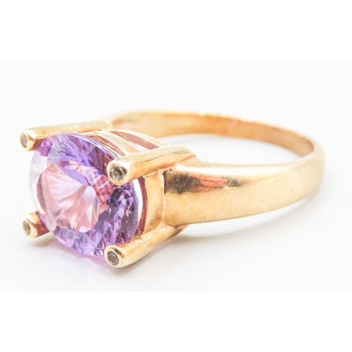 88 - Amethyst Single Stone Four Claw Set Ring Mounted in 9 Carat Yellow Gold Ring Size R