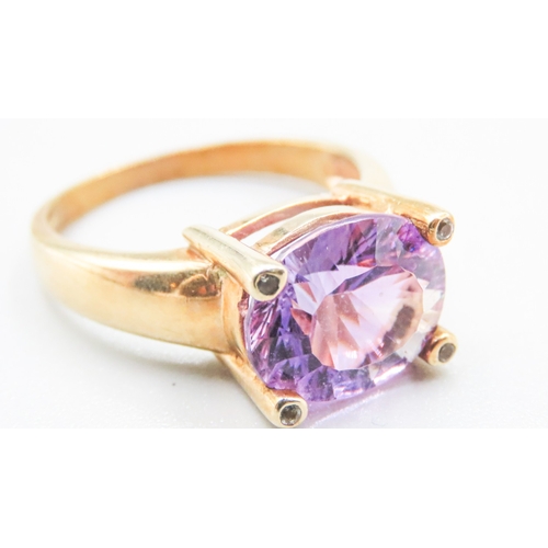 88 - Amethyst Single Stone Four Claw Set Ring Mounted in 9 Carat Yellow Gold Ring Size R