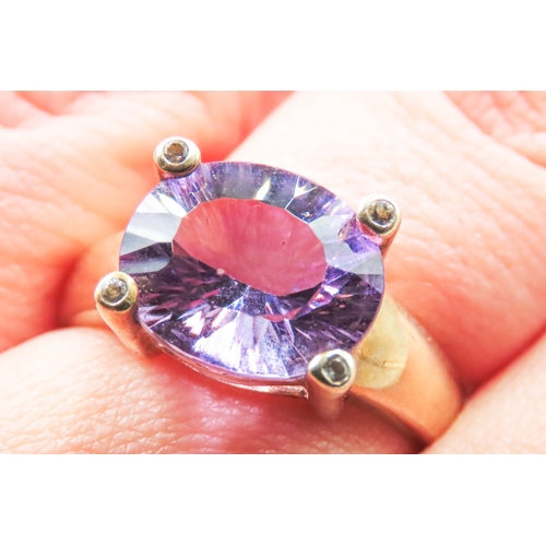 88 - Amethyst Single Stone Four Claw Set Ring Mounted in 9 Carat Yellow Gold Ring Size R