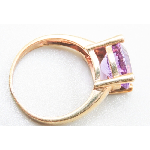 88 - Amethyst Single Stone Four Claw Set Ring Mounted in 9 Carat Yellow Gold Ring Size R