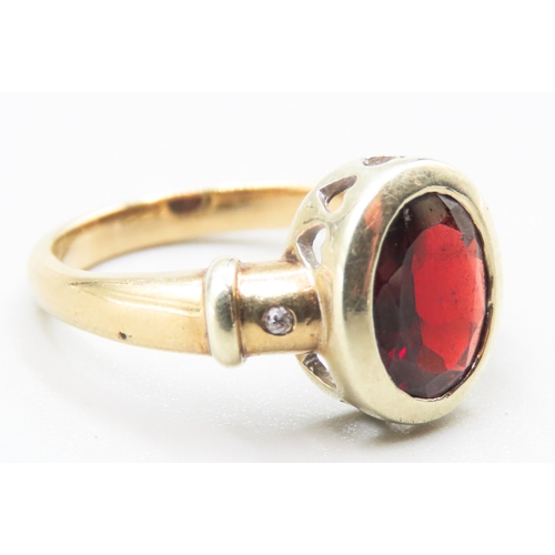 95 - Bezel Set Red Garnet Ring Heart Cut out Motifs Mounted in 9 Carat Yellow Gold Diamond Inset to Shoul... 