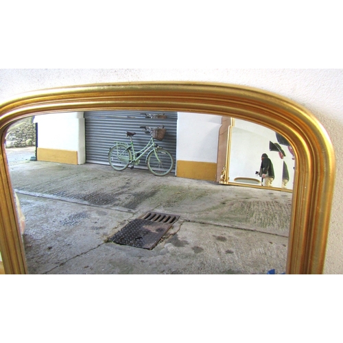 1717 - Archtop Gilded Overmantle mirror with Carved Edge Decoration Approximately 54 Inches Wide x 58 Inche... 