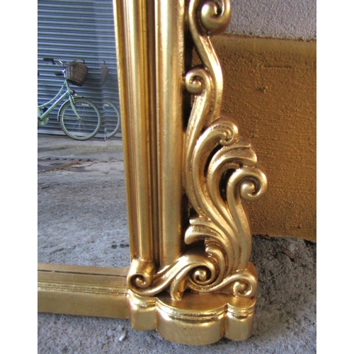 1717 - Archtop Gilded Overmantle mirror with Carved Edge Decoration Approximately 54 Inches Wide x 58 Inche... 