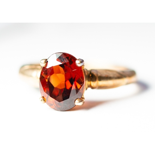 1 - Oval Cut Garnet Set Single Stone Ring Mounted in 9 Carat Yellow Gold Ring Size N and a Half