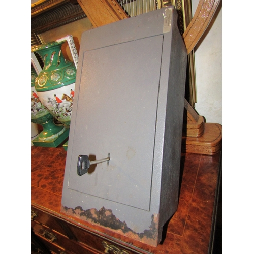 1059 - Wall Mounted Metal Safe with Key Working Order Wall Bolts Present Approximately 18 Inches High