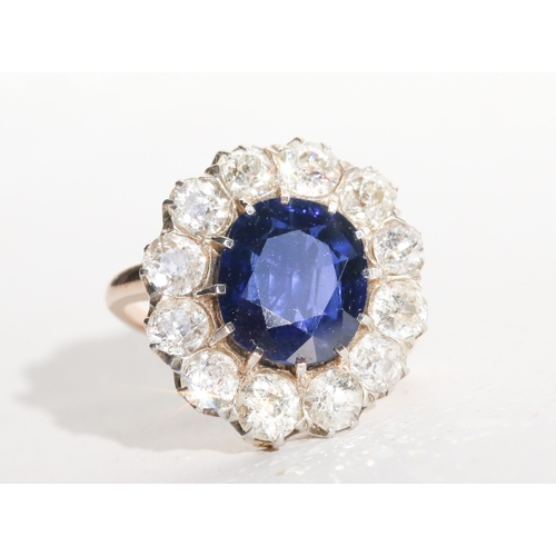 16 - Burmese No Heat Sapphire Centre Stone Ring with Twelve Stone Diamond Set Halo Surround Mounted on 18... 