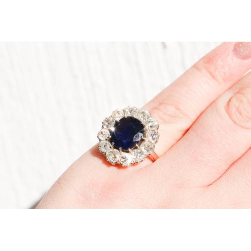 16 - Burmese No Heat Sapphire Centre Stone Ring with Twelve Stone Diamond Set Halo Surround Mounted on 18... 