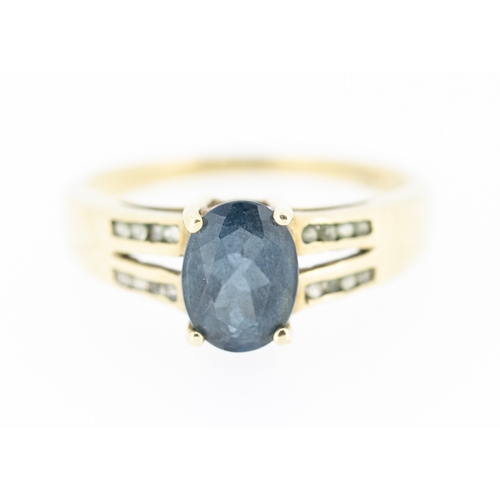 23 - Oval Cut Blue Topaz Set Ring Mounted in 9 Carat Yellow Gold Further Gemstones set to Shoulders Ring ... 