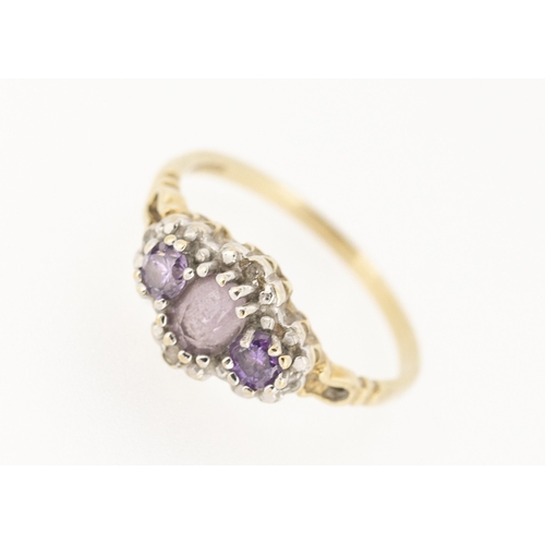 39 - Attractively Detailed Amethyst Three Stone Ring with Further Diamond Insets Mounted in 9 Carat Yello... 