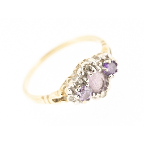 39 - Attractively Detailed Amethyst Three Stone Ring with Further Diamond Insets Mounted in 9 Carat Yello... 