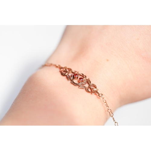 Twinstone Garnet Set Floral Motif Bracelet Mounted in 9 Carat Yellow Gold 18cm Long