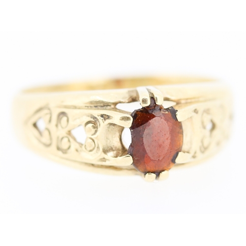 10 - Attractively Detailed Red Garnet Set Single Stone Ring Mounted in 9 Carat Yellow Gold Ring Size X