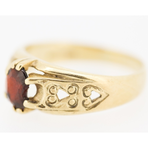 10 - Attractively Detailed Red Garnet Set Single Stone Ring Mounted in 9 Carat Yellow Gold Ring Size X