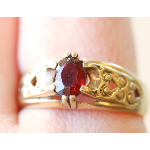 10 - Attractively Detailed Red Garnet Set Single Stone Ring Mounted in 9 Carat Yellow Gold Ring Size X