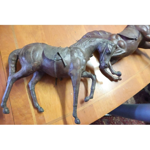 1034 - Pair of North African Leather Upholstered Horse Figures Largest Approximately 18 Inches Wide