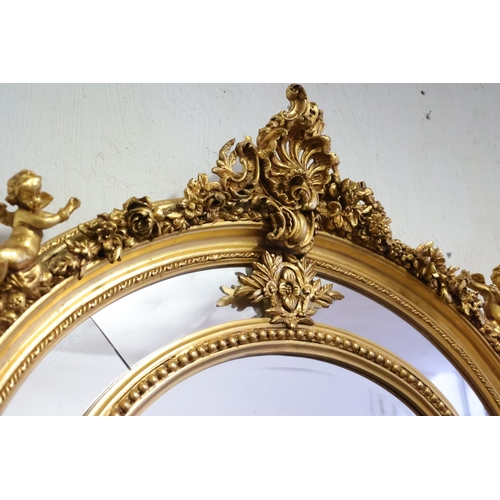 1041 - Gilded Oval Form Wall Mirror Upper Cartouche Decoration Fide Cupid Form Decoration Inset Panels Appr... 