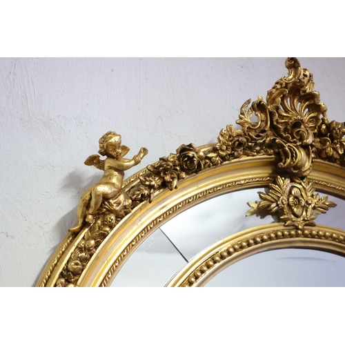 1041 - Gilded Oval Form Wall Mirror Upper Cartouche Decoration Fide Cupid Form Decoration Inset Panels Appr... 