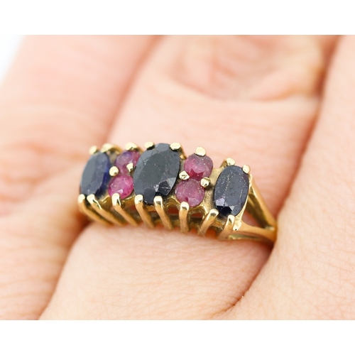 11 - Sapphire and Ruby Set Cluster Ring Mounted in 9 Carat Yellow Gold Ring Size O