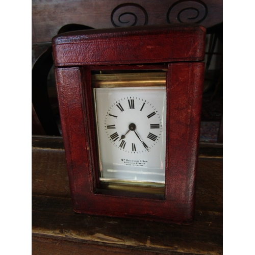 1121 - Leather Cased Brass Bound Carriage Clock Working with Key 6 Inches High Including Case