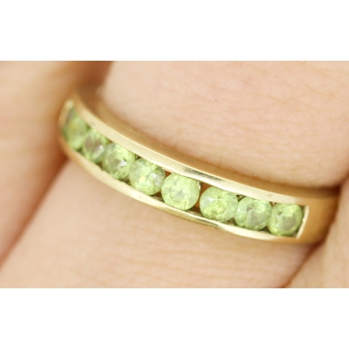 127 - Peridot Nine Stone Set Ring Mounted in 9 Carat Yellow Gold Ring Size N